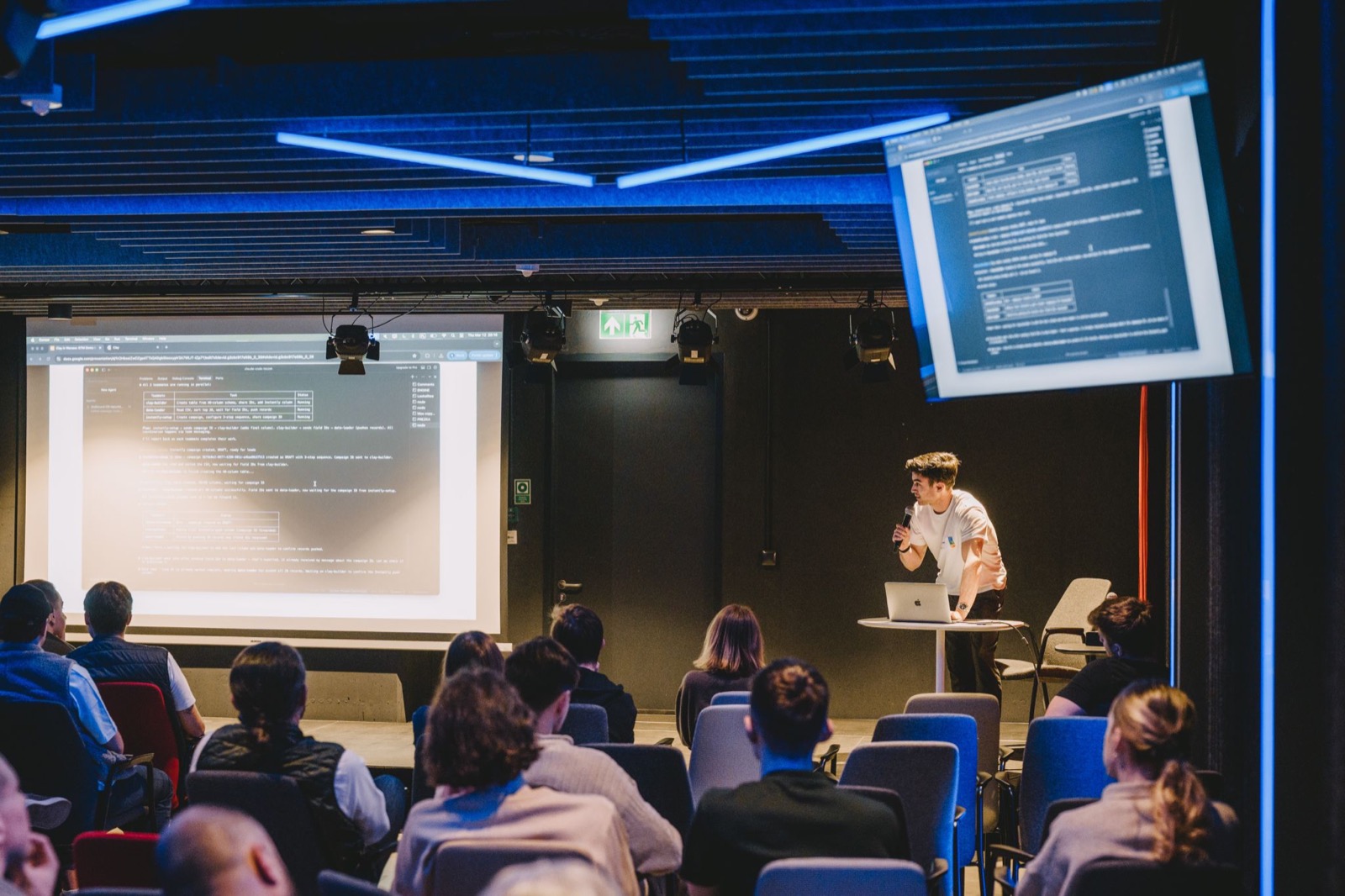 Leszek speaking on stage